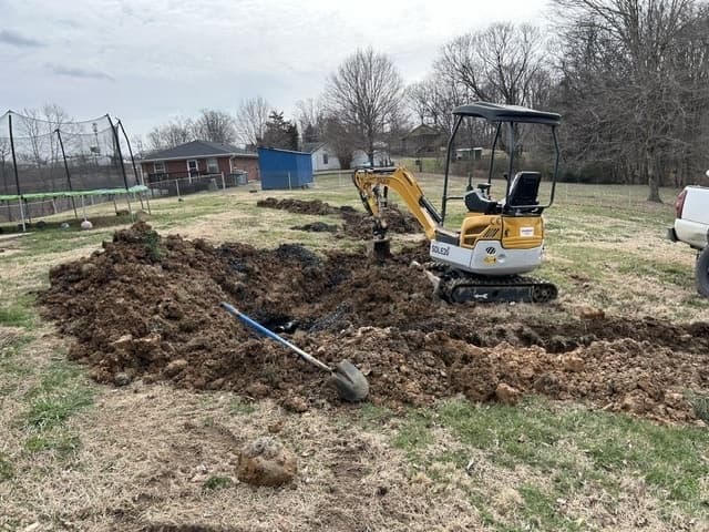 Mini excavator on job site